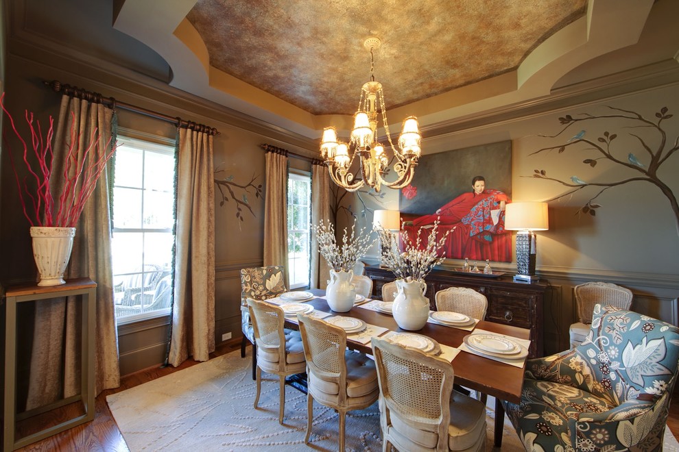 World-inspired dining room in Charlotte with beige walls and dark hardwood flooring.