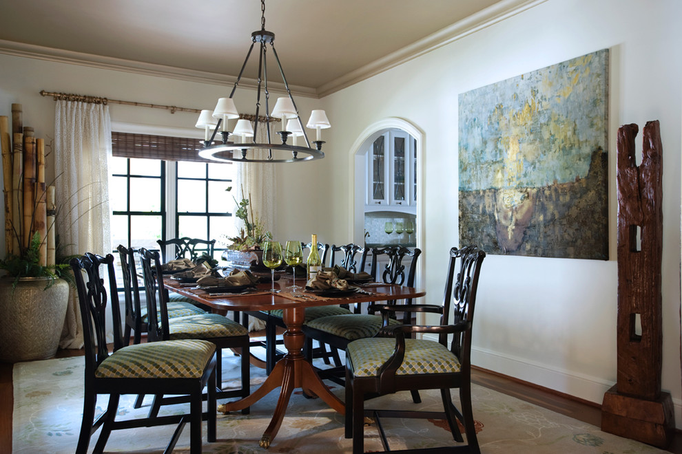 Eclectic enclosed dining room in Other with white walls, medium hardwood flooring and brown floors.