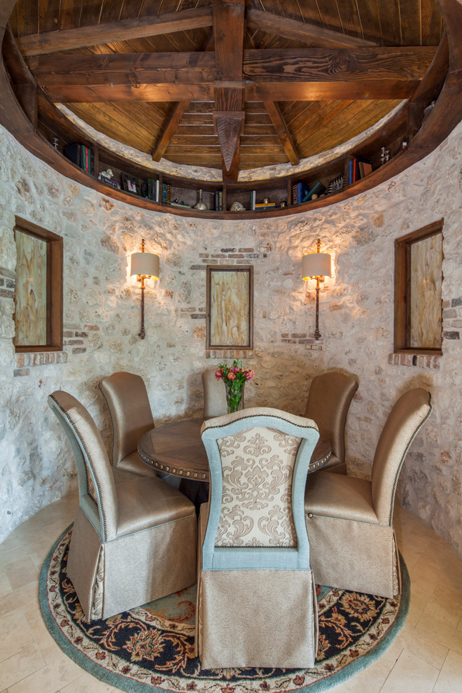 Example of a tuscan kitchen/dining room combo design in Austin with beige walls