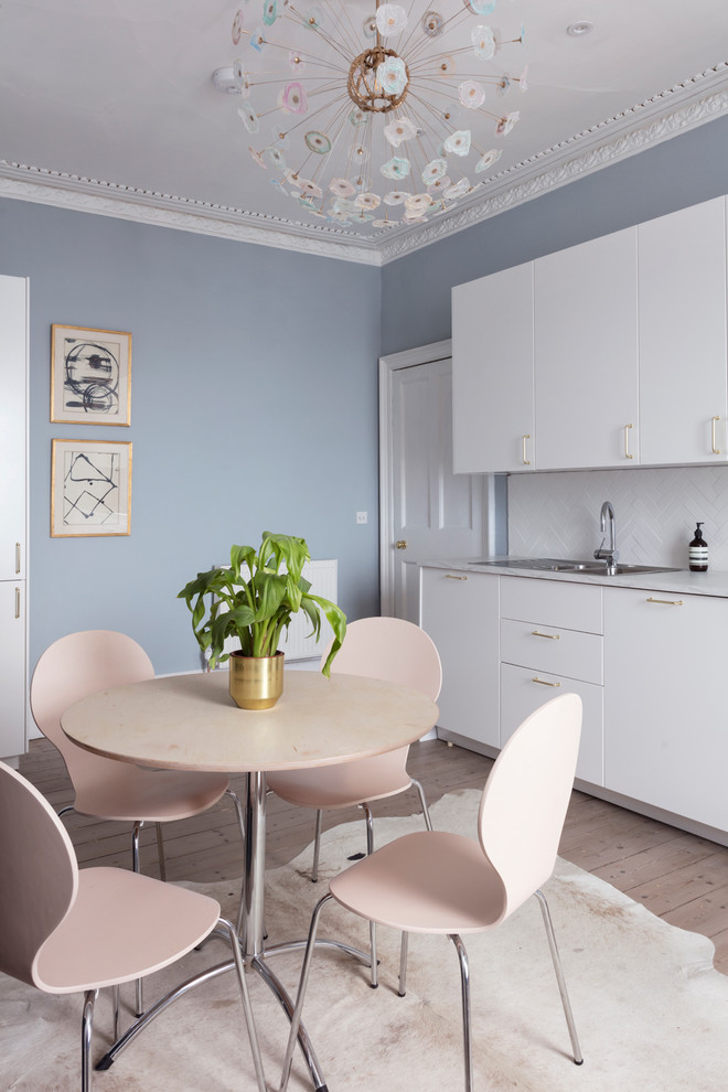 Medium sized classic kitchen/dining room in Edinburgh with light hardwood flooring, grey floors and blue walls.