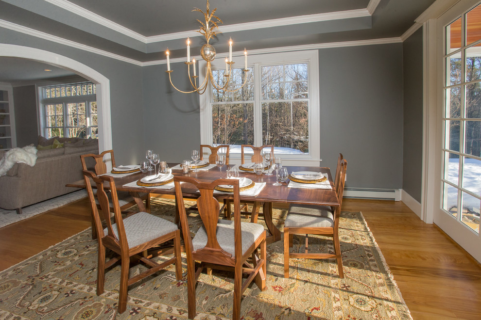 Photo of a medium sized traditional enclosed dining room in Burlington with grey walls and medium hardwood flooring.