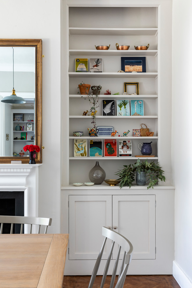 Contemporary open plan dining room in London with grey walls.