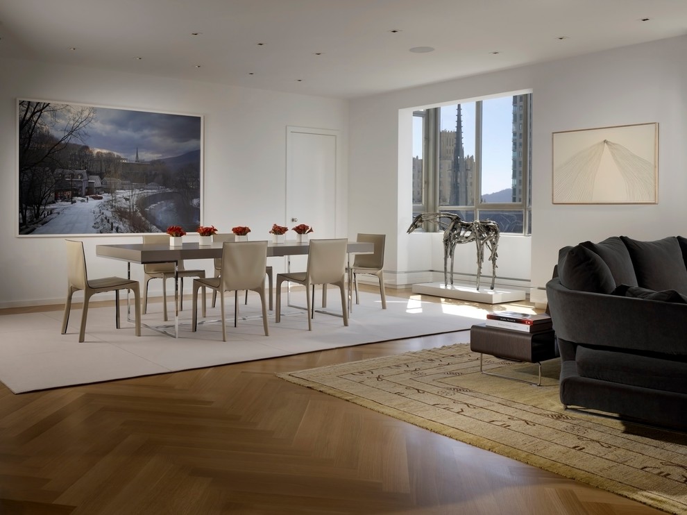 Large contemporary open plan dining room in San Francisco with white walls, medium hardwood flooring and no fireplace.