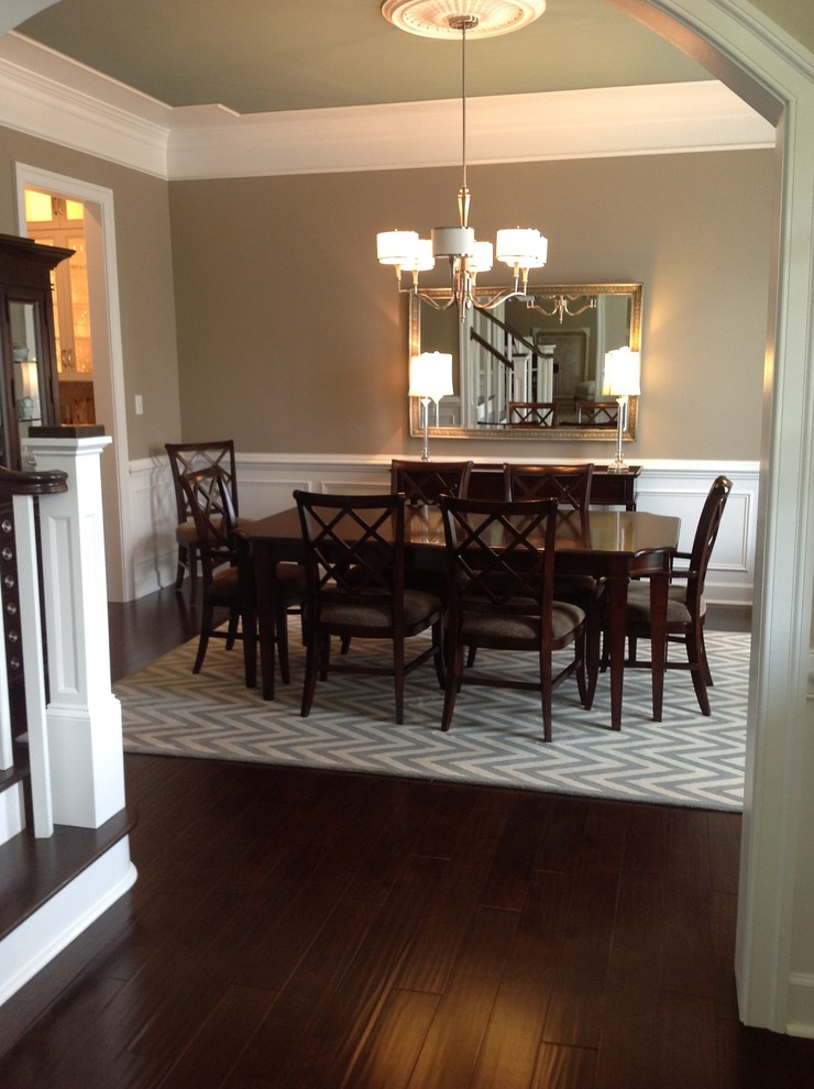 Inspiration for a large timeless dark wood floor enclosed dining room remodel in Baltimore with beige walls and no fireplace