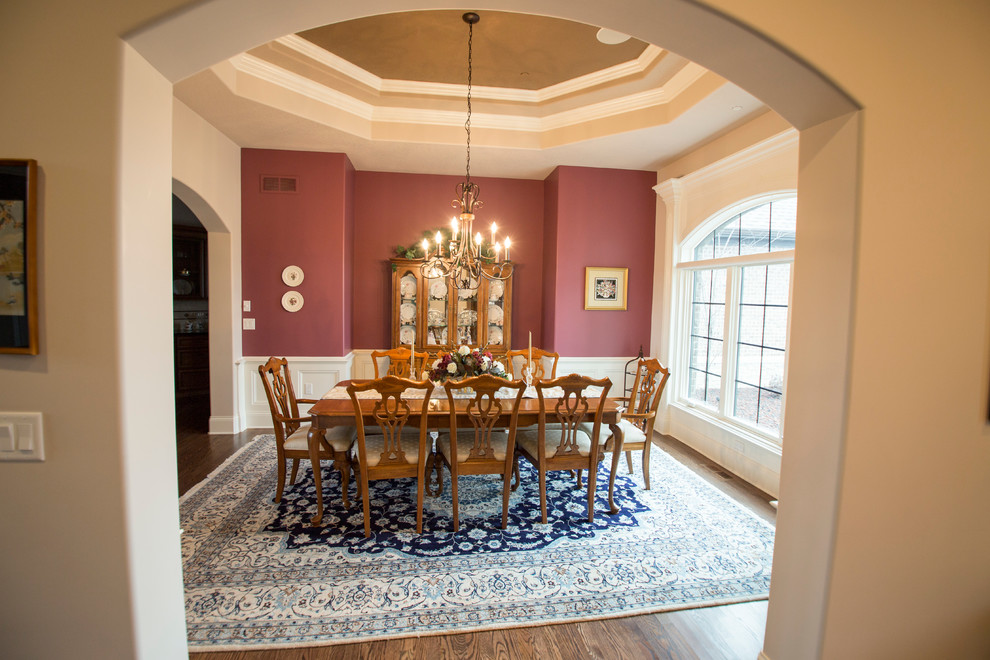Photo of a large traditional enclosed dining room in Other with beige walls, medium hardwood flooring and no fireplace.