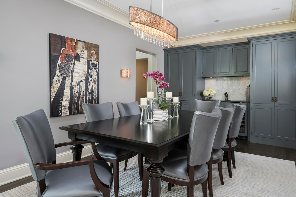 Example of a large transitional carpeted enclosed dining room design in Chicago with gray walls and no fireplace