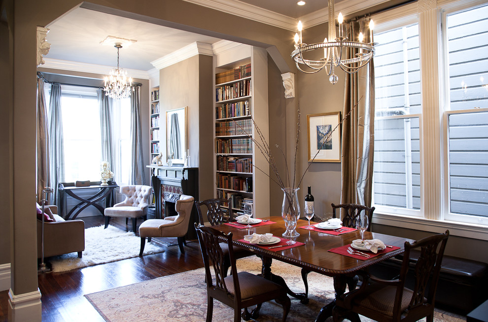 Inspiration for a mid-sized timeless dark wood floor and brown floor dining room remodel in San Francisco with a standard fireplace, beige walls and a tile fireplace