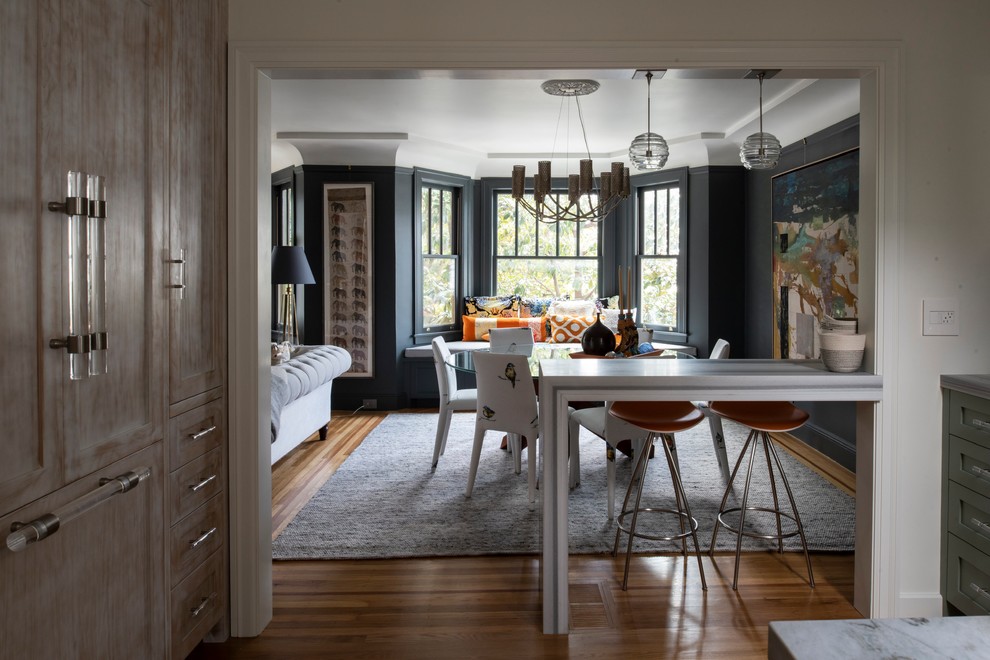 Photo of a contemporary open plan dining room in San Francisco with black walls, medium hardwood flooring and brown floors.