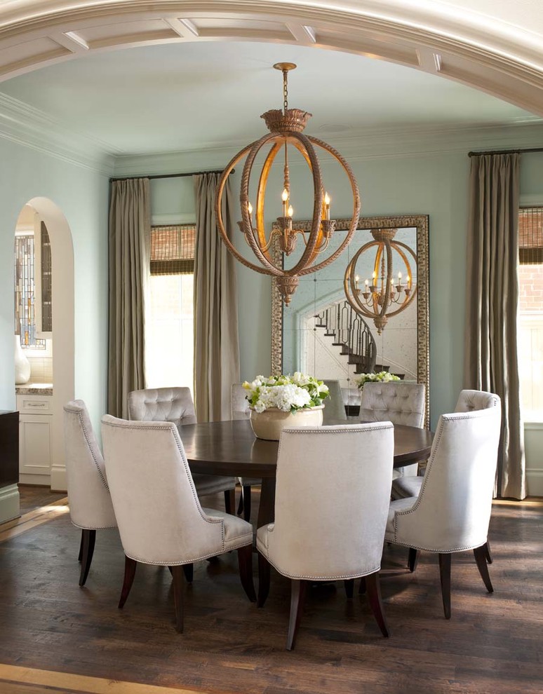 Design ideas for a classic dining room in Dallas with brown floors.
