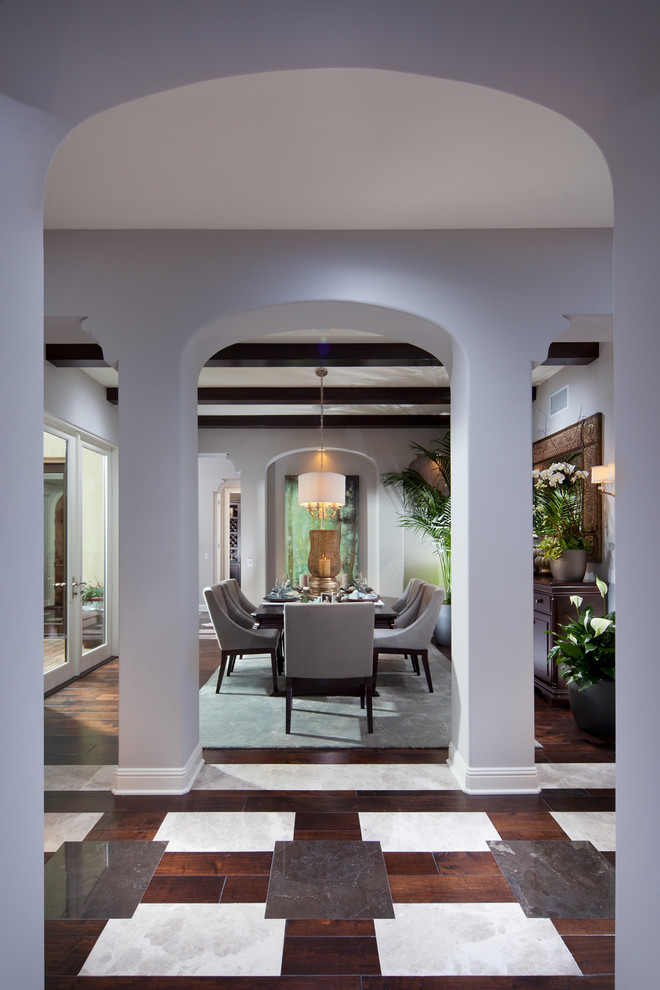 This is an example of a contemporary dining room in Denver with white walls.