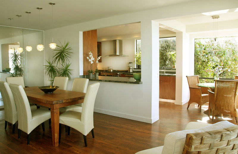 This is an example of a medium sized beach style kitchen/dining room in San Diego with beige walls and medium hardwood flooring.