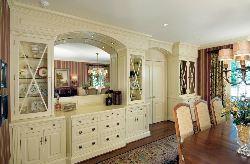 Photo of an expansive traditional enclosed dining room in Philadelphia with red walls and medium hardwood flooring.