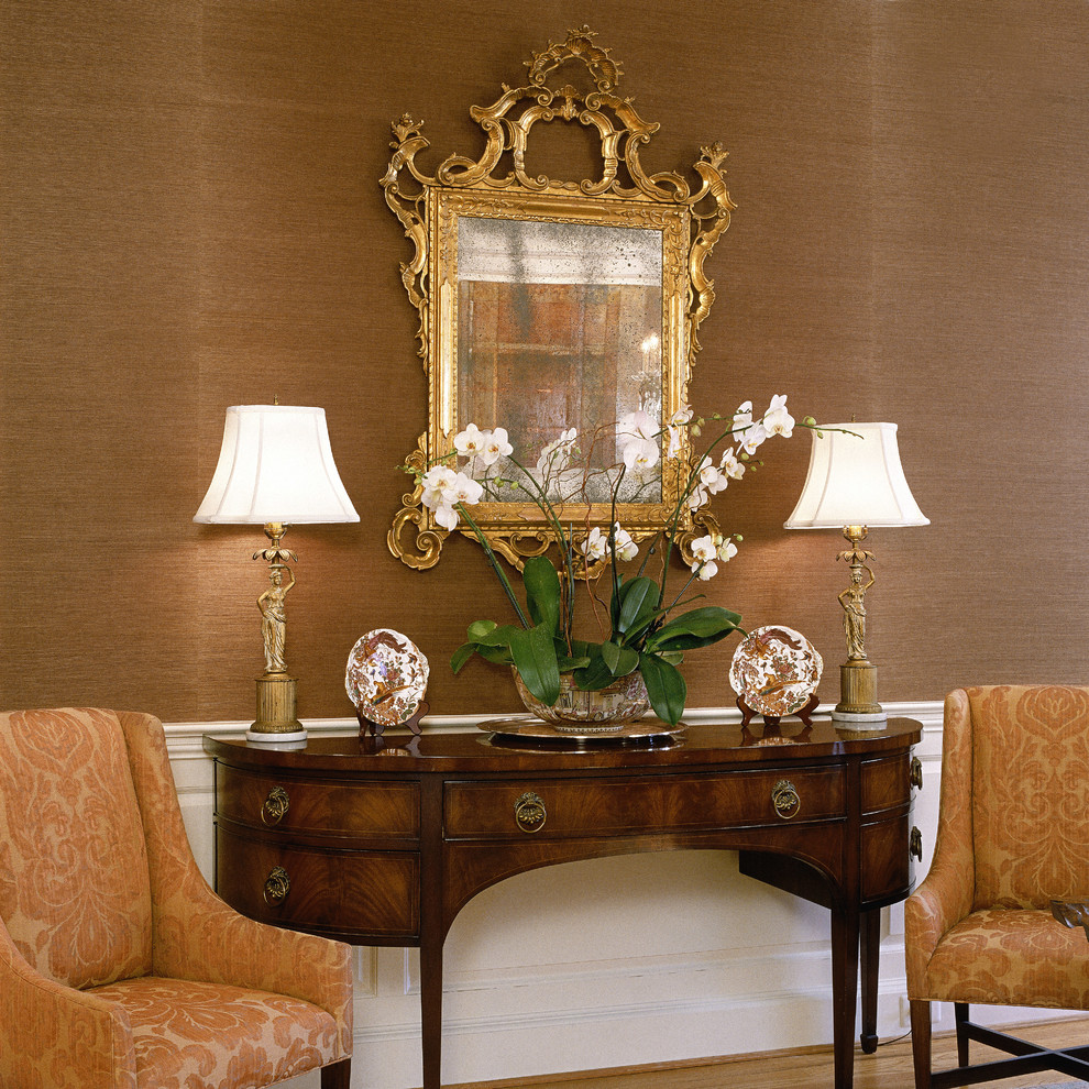 Photo of a large classic enclosed dining room in DC Metro with beige walls and medium hardwood flooring.
