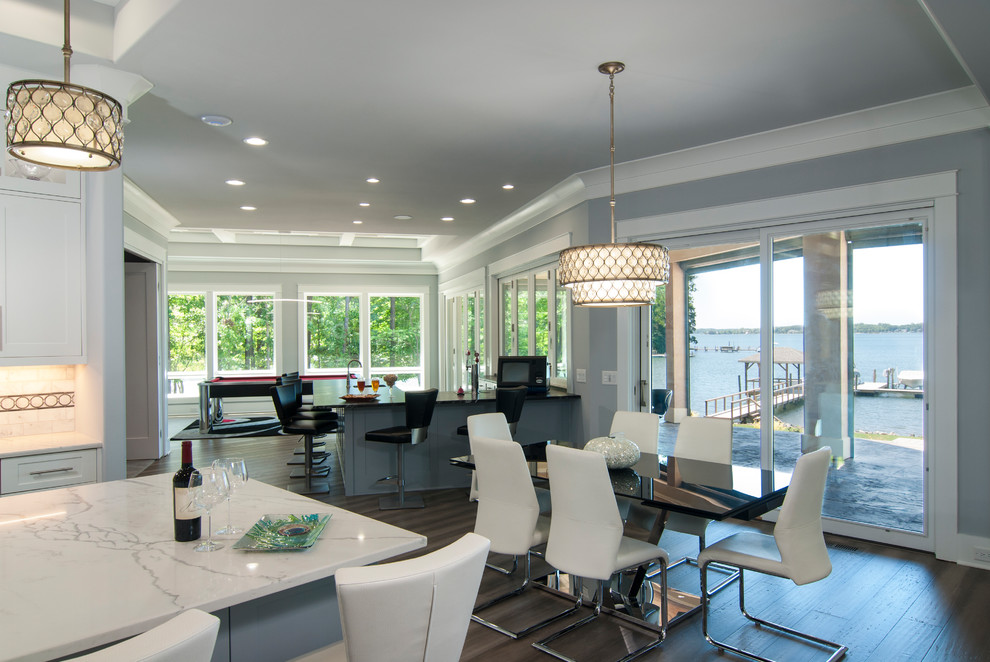 Inspiration for a large contemporary open plan dining room in Charlotte with medium hardwood flooring, brown floors, grey walls and no fireplace.
