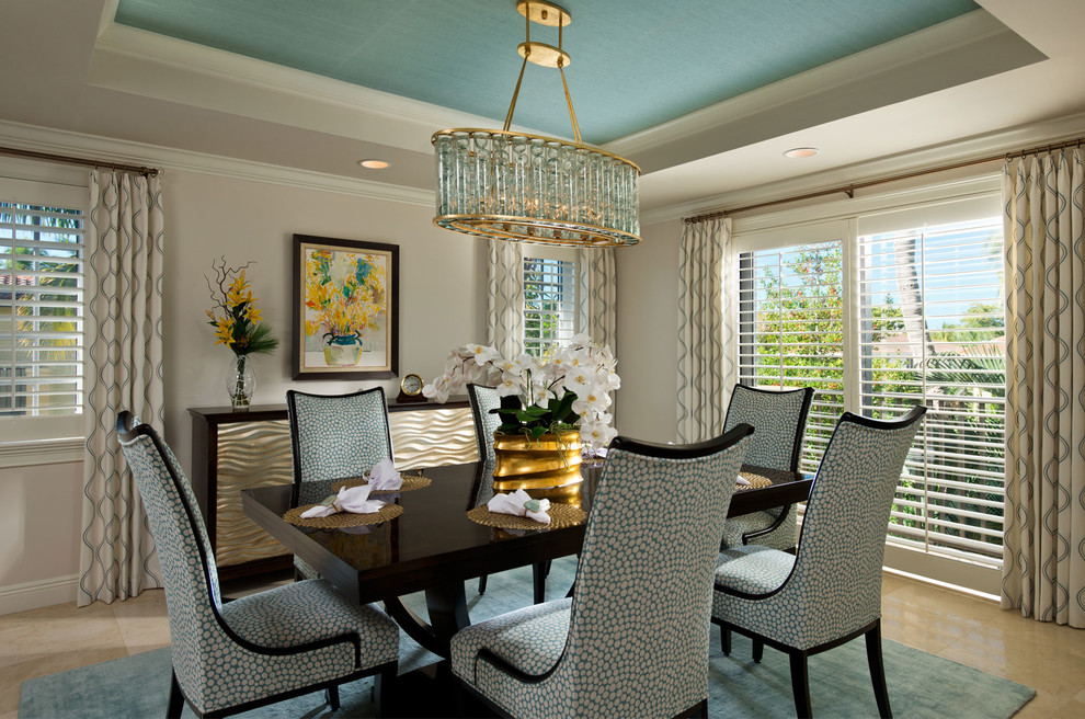 Photo of a coastal enclosed dining room in Miami with beige walls.
