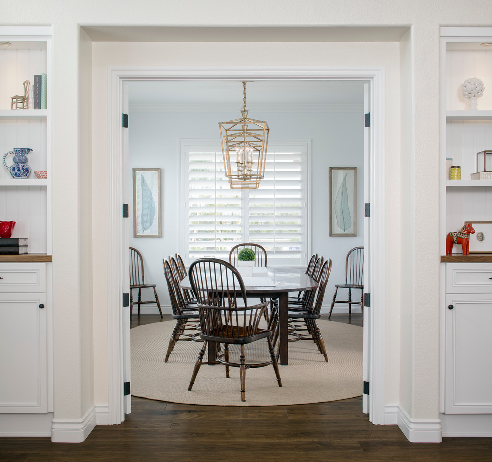 Photo of a medium sized traditional enclosed dining room in San Francisco with white walls and dark hardwood flooring.