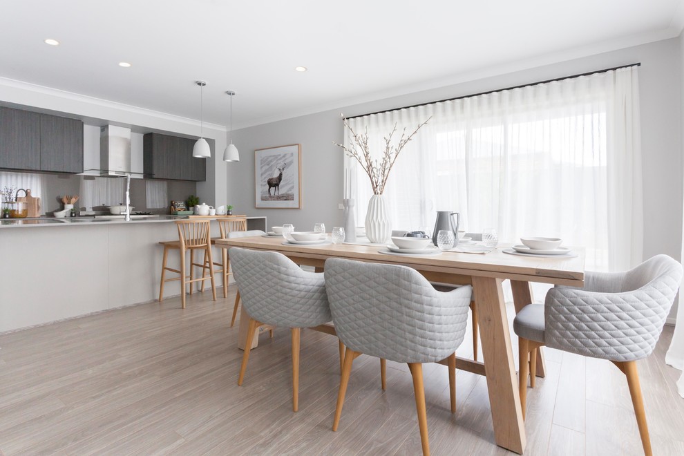 Inspiration for a scandinavian light wood floor and beige floor kitchen/dining room combo remodel in Melbourne with gray walls