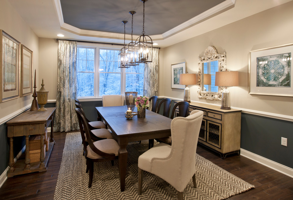 Inspiration for a traditional dining room in Boston with beige walls and dark hardwood flooring.