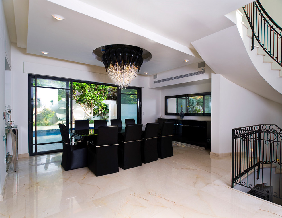 This is an example of a contemporary dining room in Other with white walls and marble flooring.