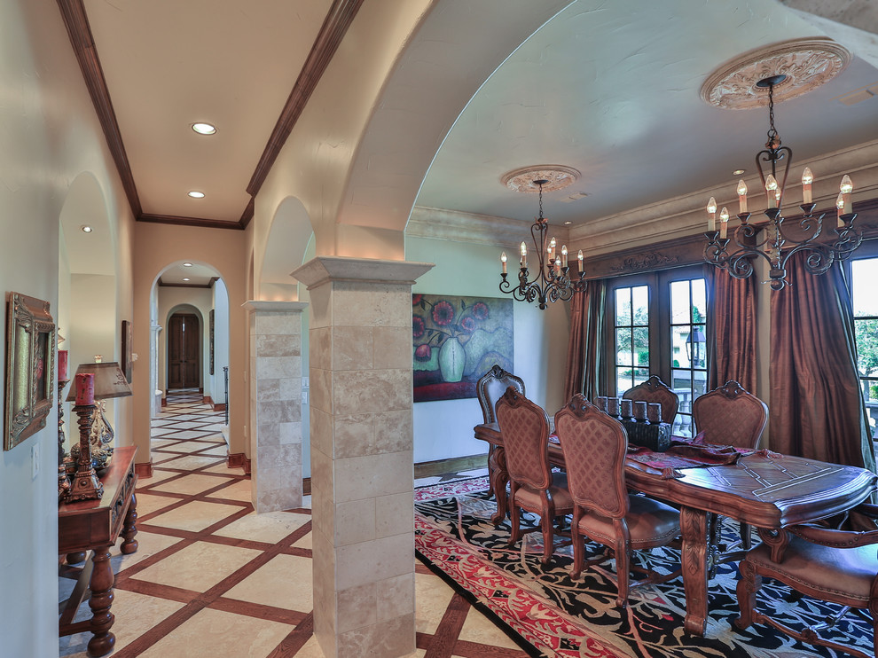 This is an example of a medium sized mediterranean kitchen/dining room in Dallas with beige walls, limestone flooring, no fireplace and beige floors.