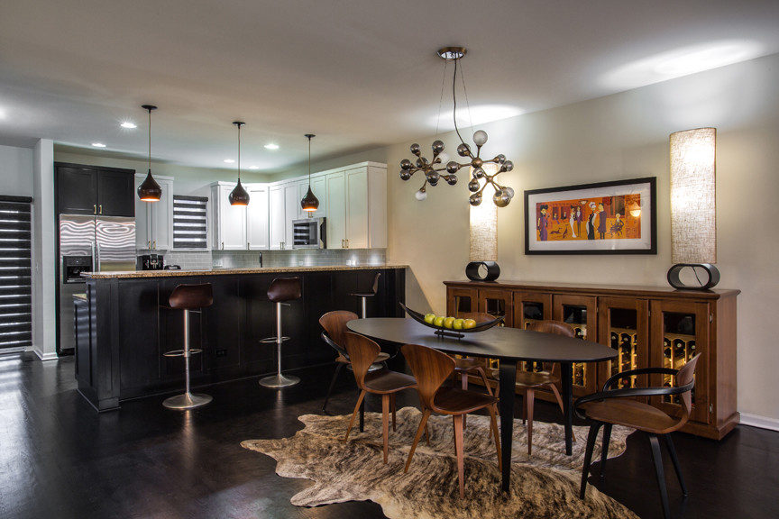 Medium sized modern kitchen/dining room in Chicago with beige walls, dark hardwood flooring and brown floors.