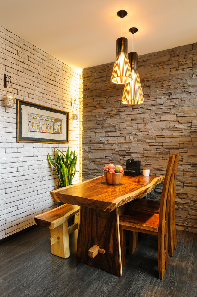 Inspiration for a small rustic dining room in Singapore with dark hardwood flooring.