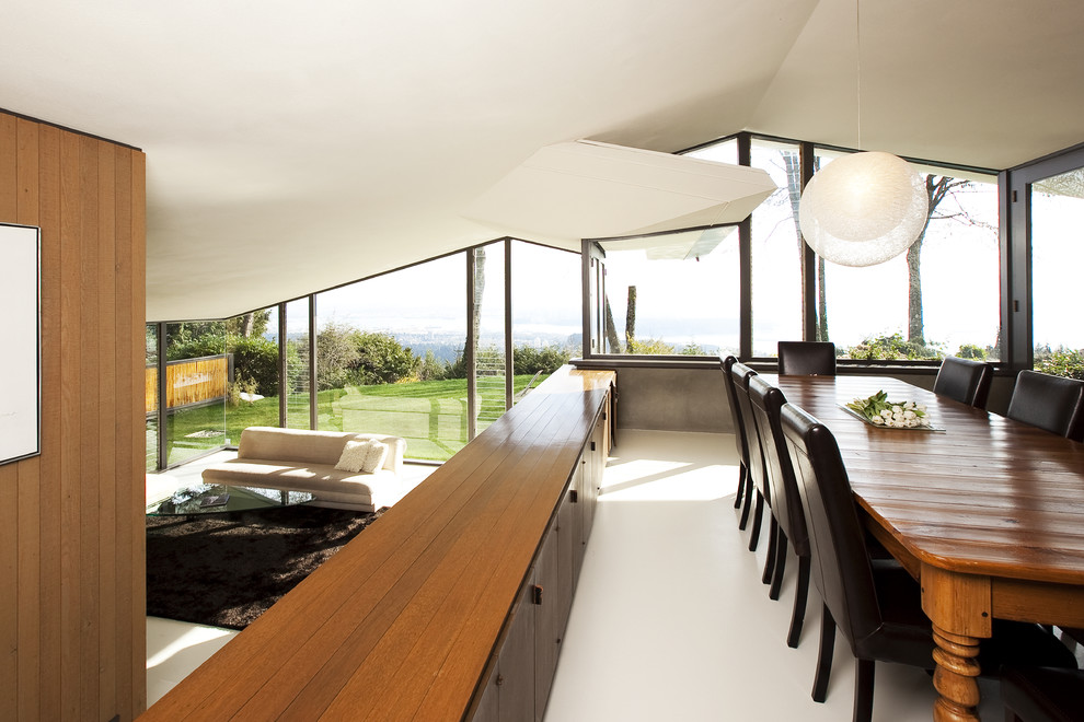 Идея дизайна: гостиная-столовая среднего размера в стиле модернизм с бетонным полом