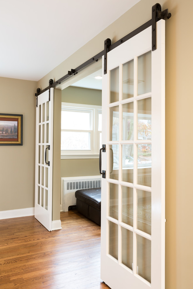 Inspiration for a medium sized farmhouse enclosed dining room in New York with grey walls, medium hardwood flooring and no fireplace.