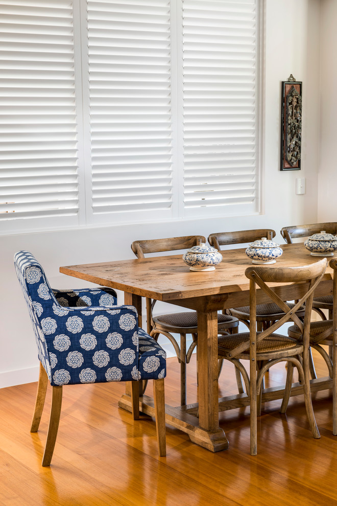Small elegant medium tone wood floor dining room photo in Gold Coast - Tweed with beige walls