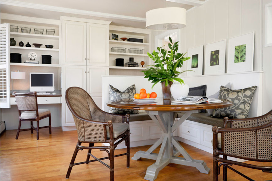 Medium sized traditional kitchen/dining room in Boston with white walls and light hardwood flooring.