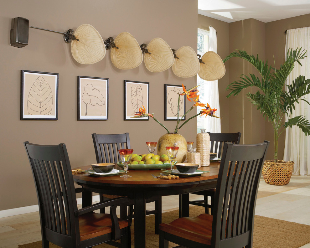 Photo of a medium sized world-inspired enclosed dining room in San Diego with brown walls and no fireplace.