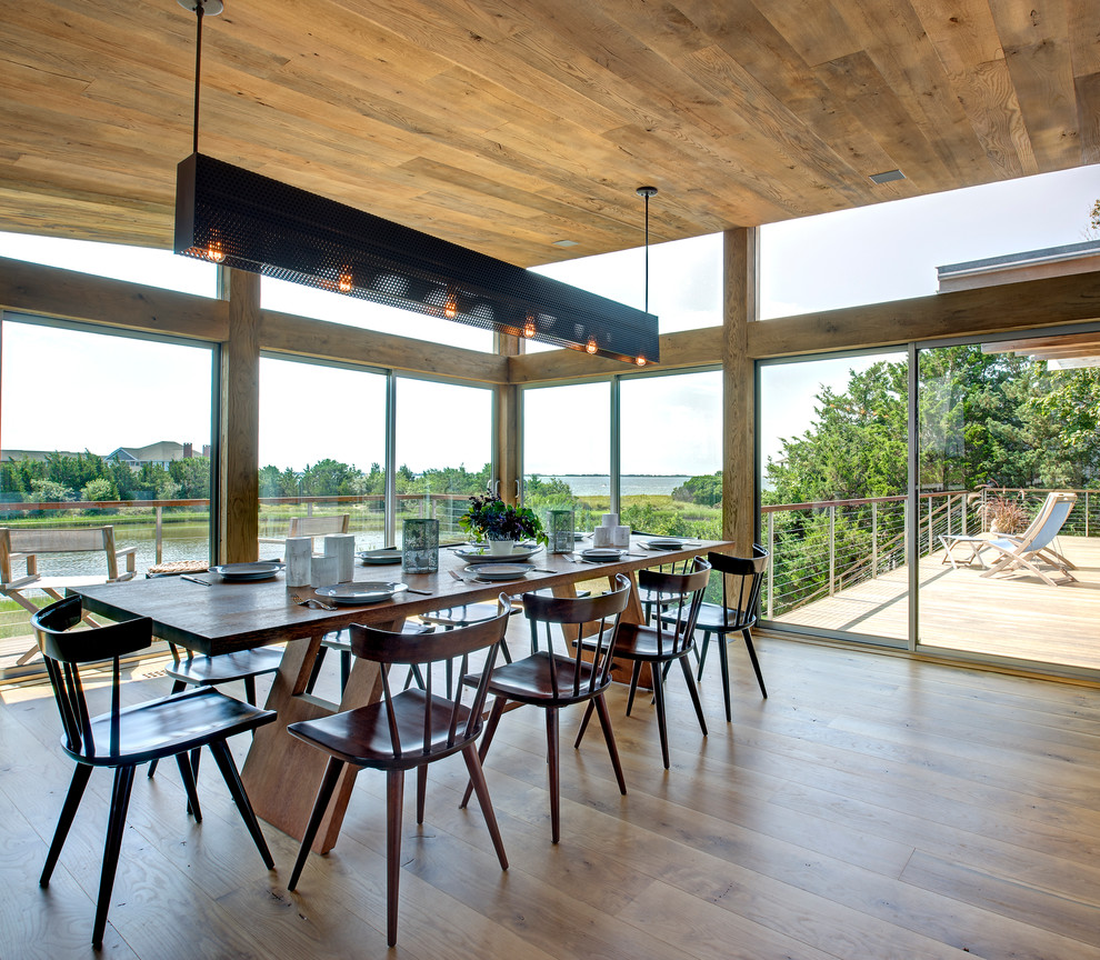 Dining room - contemporary medium tone wood floor dining room idea in New York