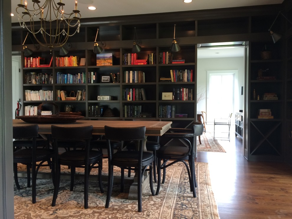Design ideas for a large classic enclosed dining room in Chicago with black walls, dark hardwood flooring and no fireplace.