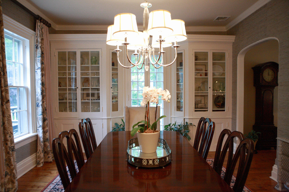 Inspiration for a large country medium tone wood floor enclosed dining room remodel in New York with blue walls