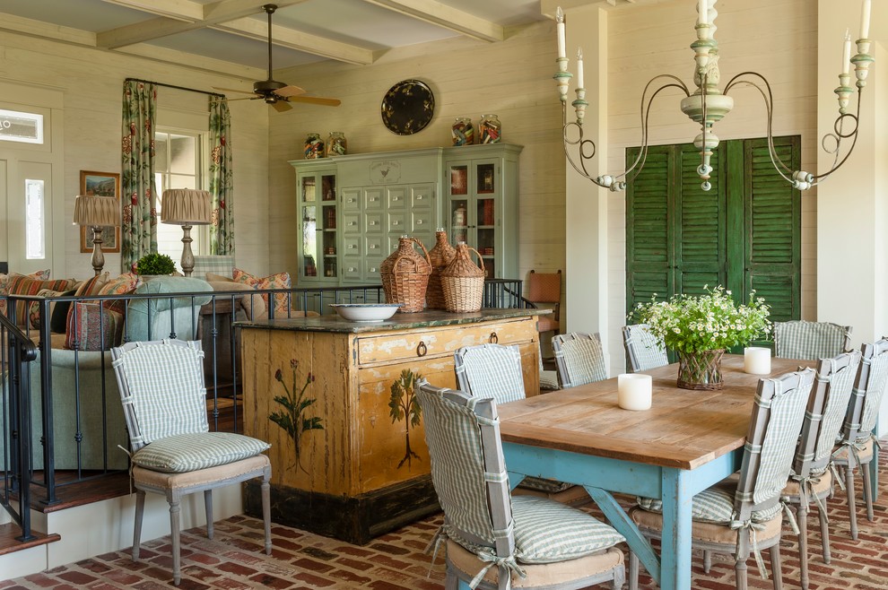 Photo of a dining room in Houston with beige walls and brick flooring.