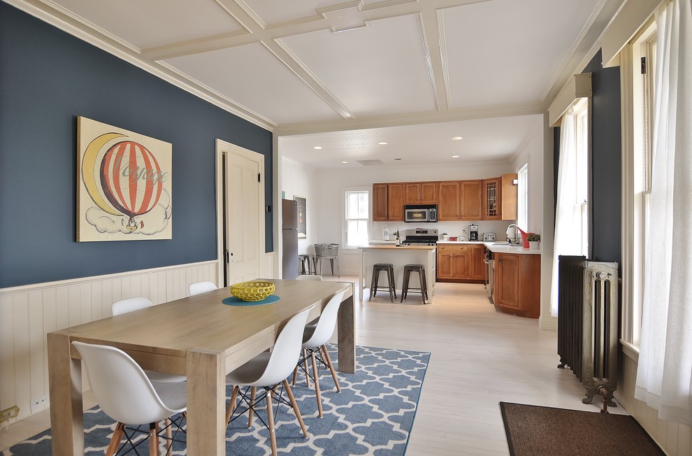 This is an example of a large scandi kitchen/dining room in New York with painted wood flooring.