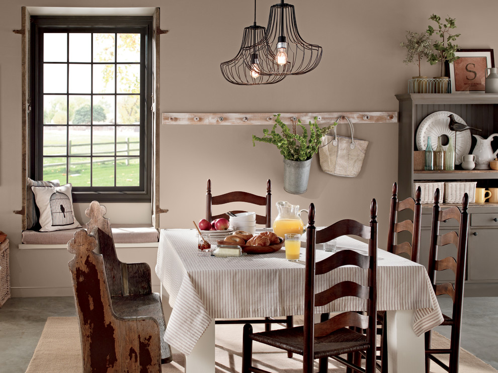 This is an example of a rustic dining room in Orange County.