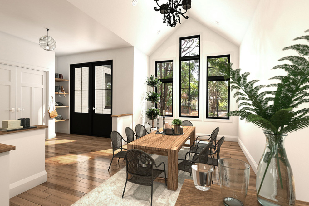 Example of a country light wood floor, brown floor and vaulted ceiling dining room design in Other with white walls