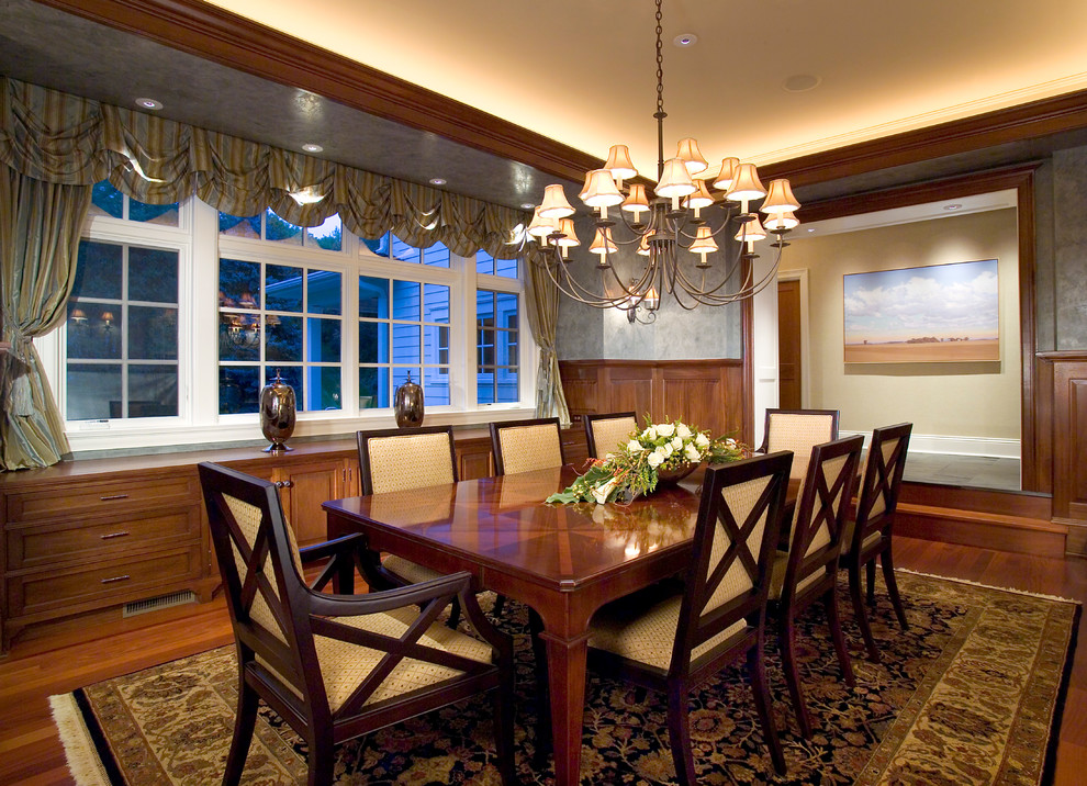 Photo of a large classic enclosed dining room in Minneapolis with grey walls, medium hardwood flooring, no fireplace and brown floors.