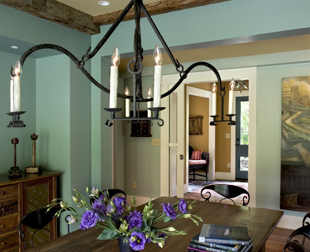 Example of a cottage dining room design in Burlington with green walls
