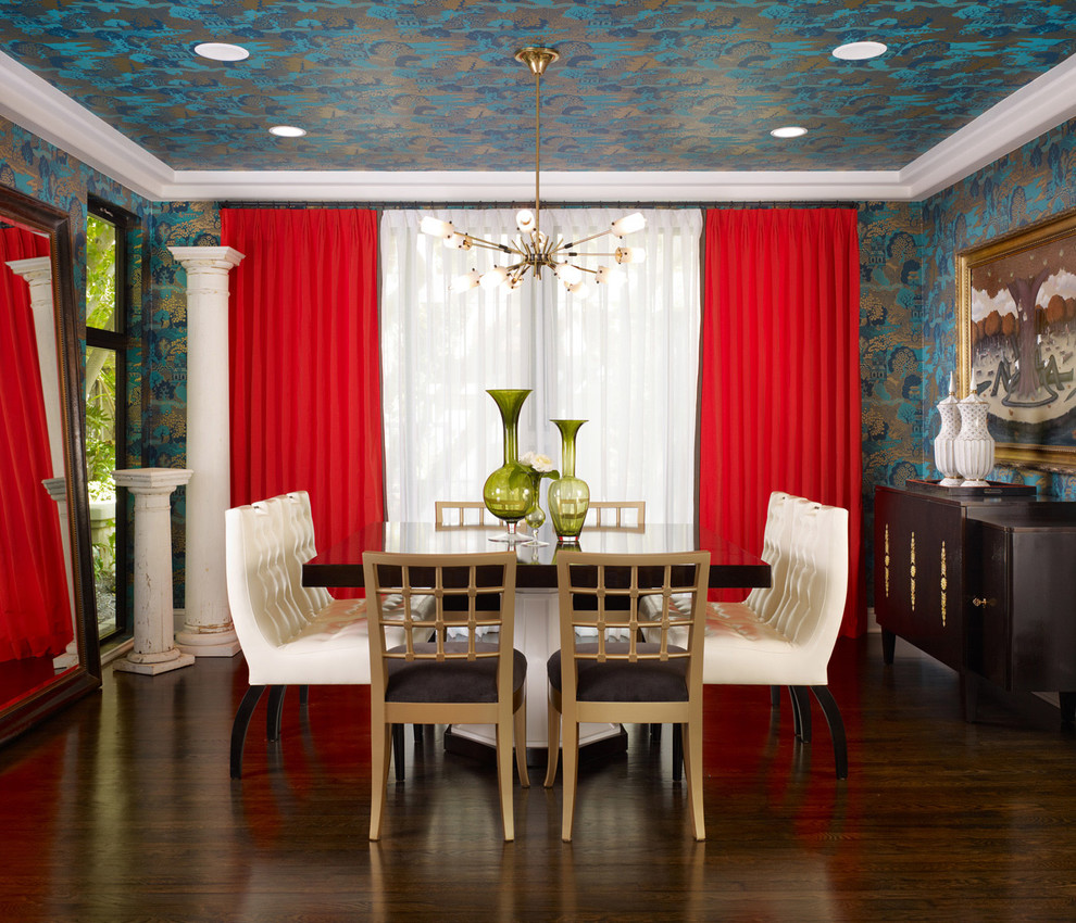 Photo of a contemporary enclosed dining room in Los Angeles with multi-coloured walls and dark hardwood flooring.