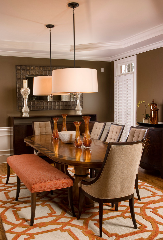 Inspiration for a contemporary dining room remodel in San Diego with brown walls