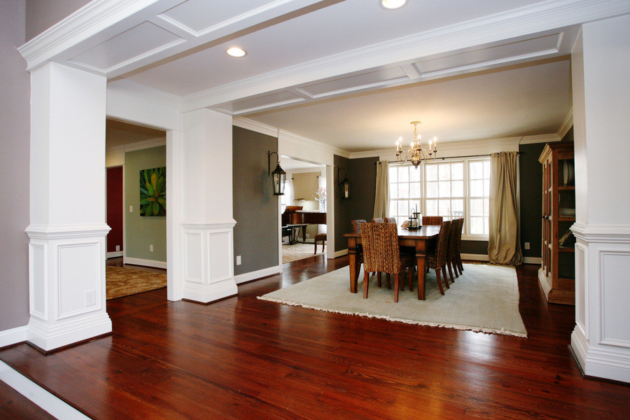 Large elegant dark wood floor and brown floor enclosed dining room photo in Raleigh with gray walls and no fireplace