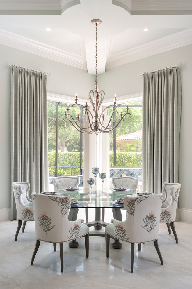 Dining room - transitional gray floor dining room idea in Miami with gray walls and no fireplace