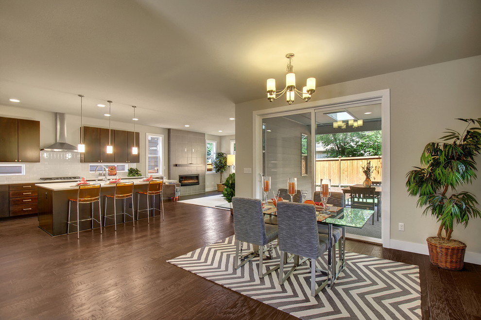 Inspiration for a contemporary open plan dining room in Seattle with grey walls and dark hardwood flooring.