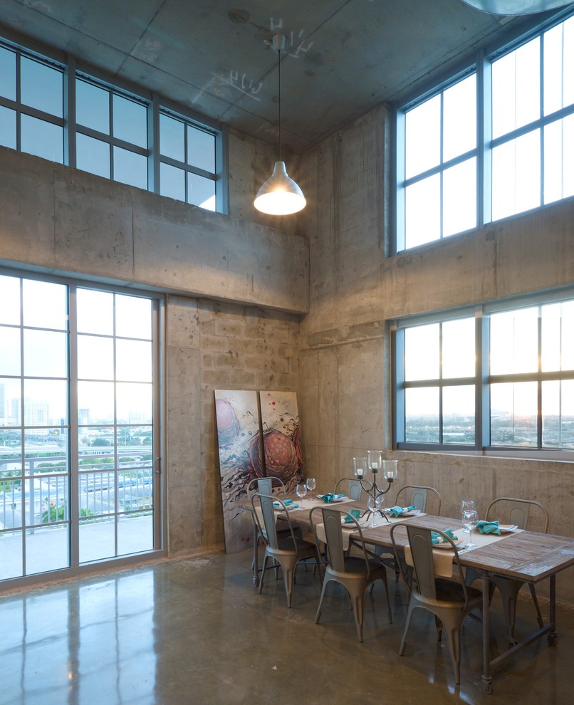 Large urban concrete floor great room photo in Miami
