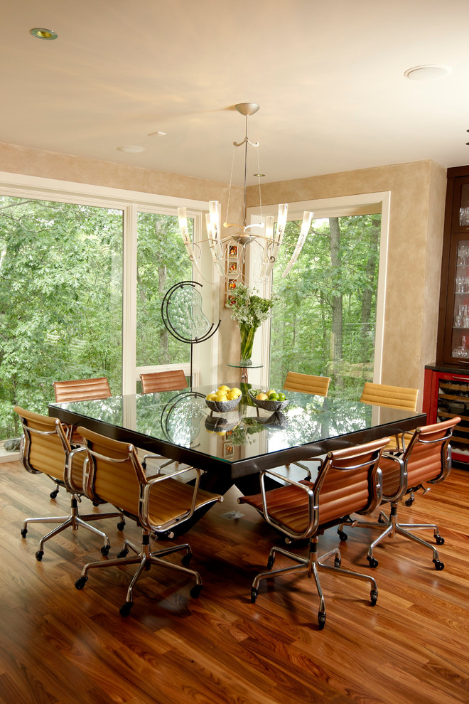 Inspiration for a contemporary dining room in Minneapolis with beige walls and dark hardwood flooring.