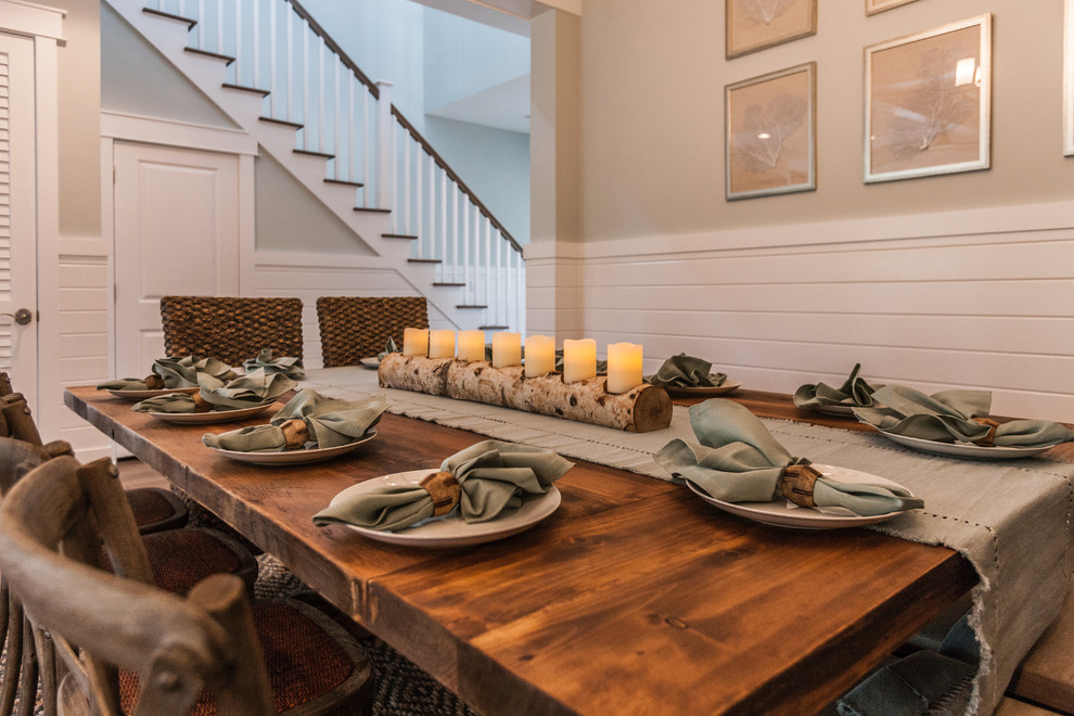 This is an example of a large nautical dining room in Other with green walls, medium hardwood flooring and brown floors.