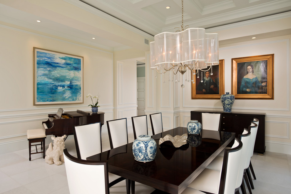 Photo of a large traditional enclosed dining room in Miami with beige walls.