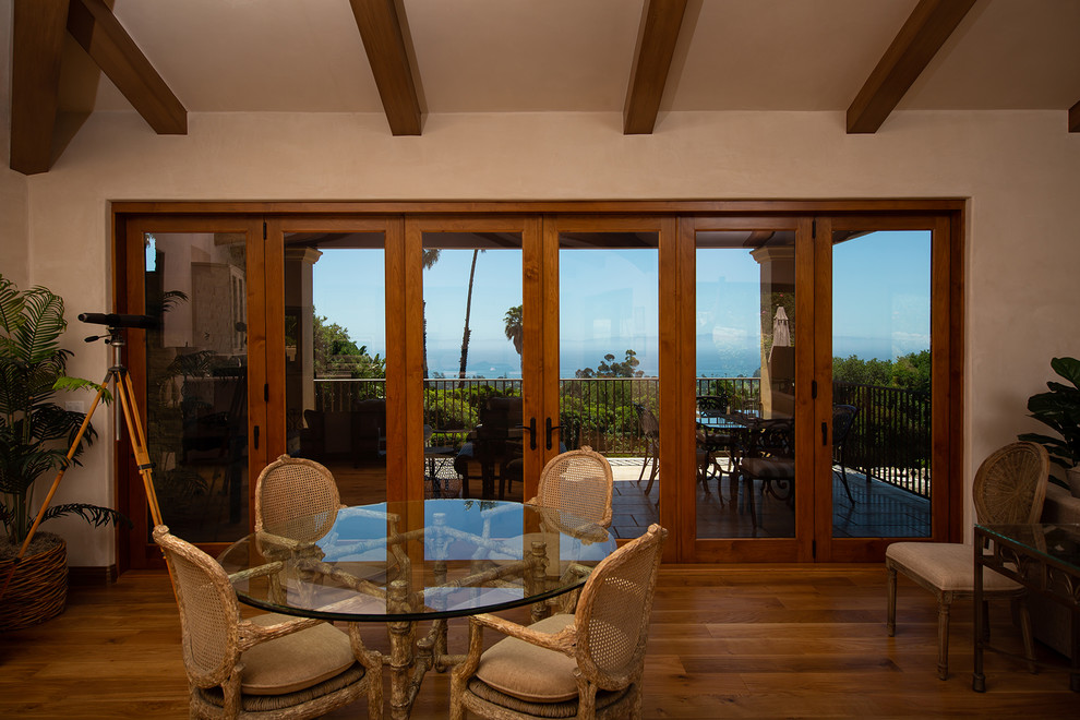 Great room - mid-sized mediterranean medium tone wood floor great room idea in Santa Barbara with beige walls